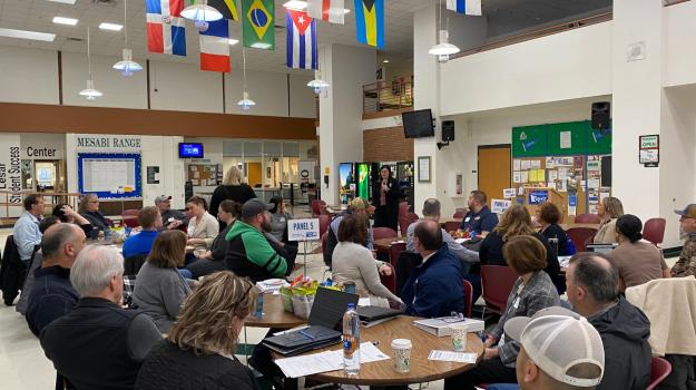 UWNEMN Executive Director Erin Shay speaks to a crowd of UWNEMN donors and volunteers at Minnesota North College Mesabi Range campus in Virginia