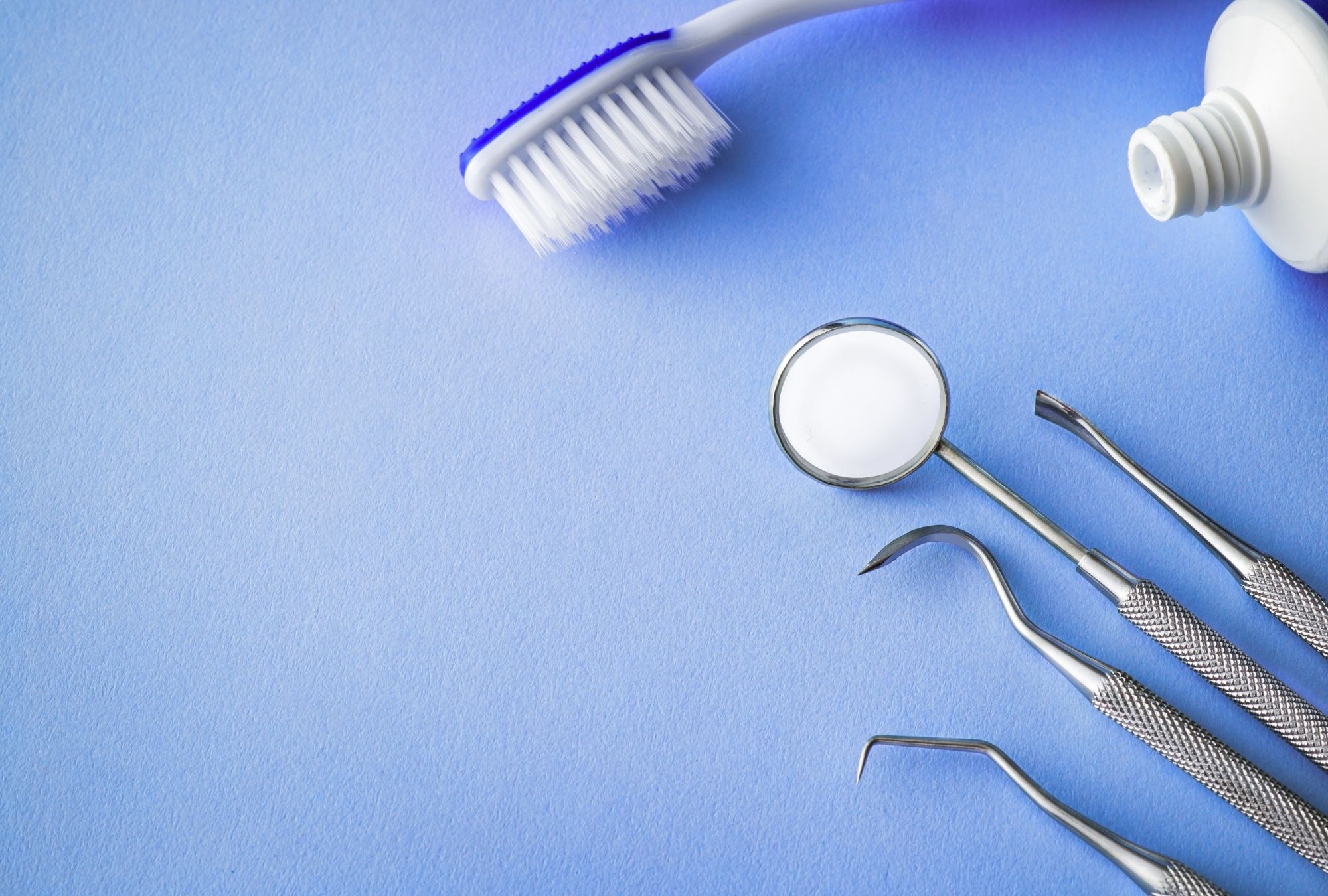 dental tools on a blue background
