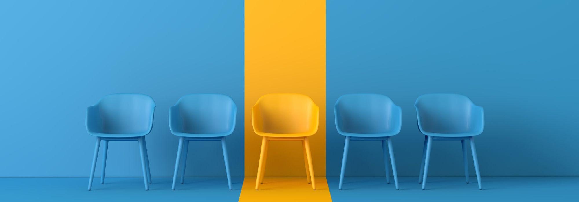 blue chairs on blue background, in the middle a yellow chair with yellow spotlight