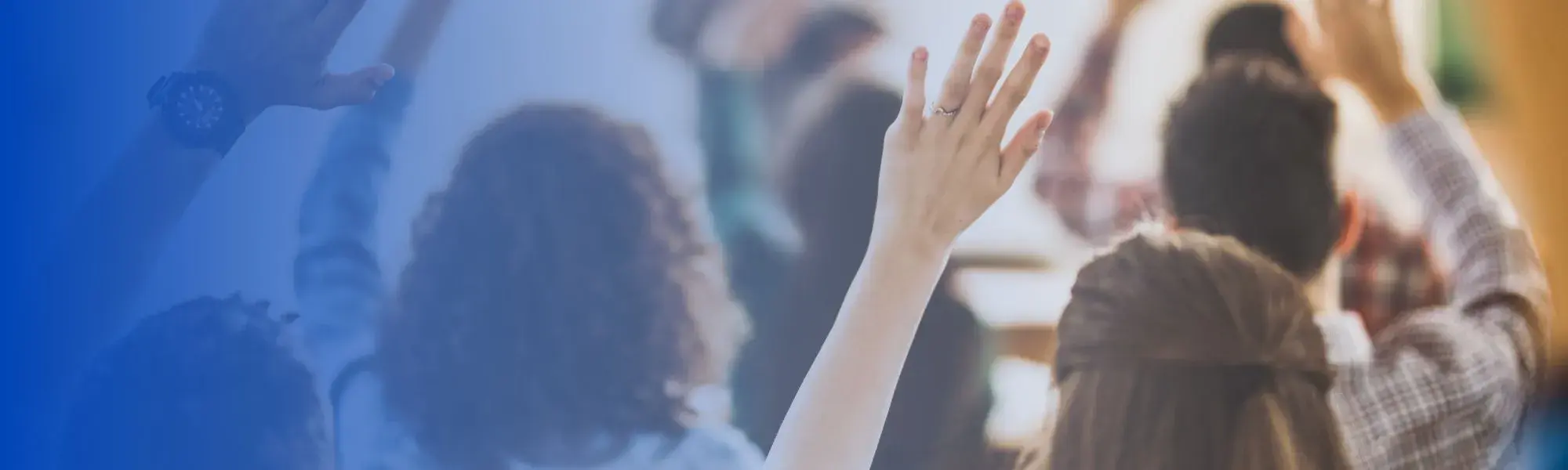 hands raised behind blue background