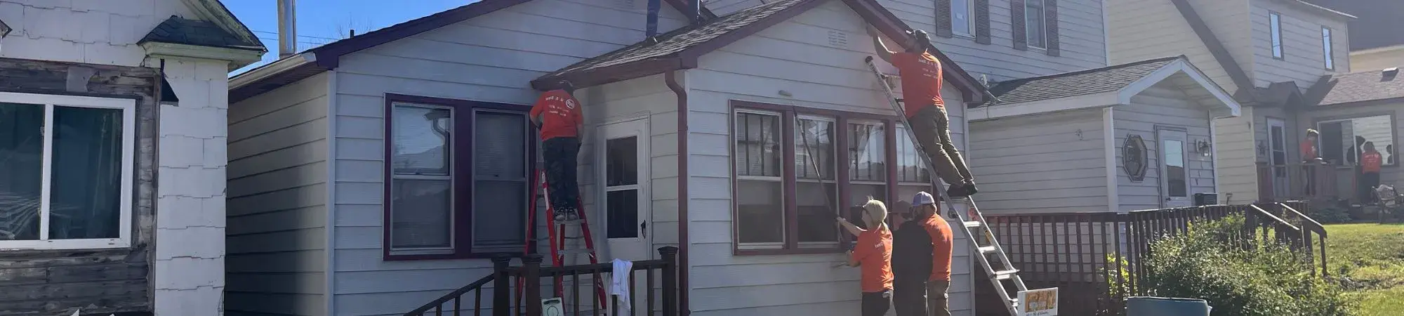 U. S. Steel employees work on a house during Day of Action