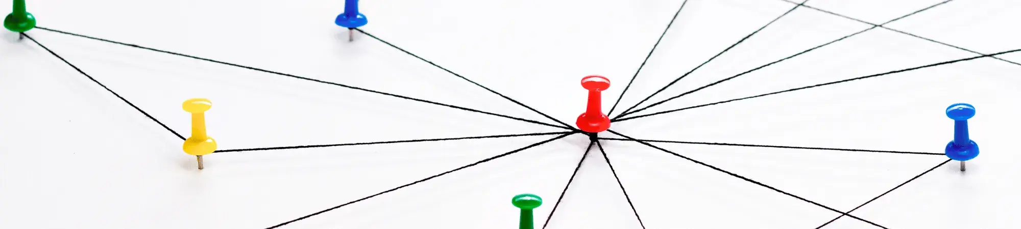 strings tied together with red, yellow, blue, and green pins