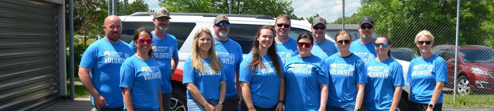 U. S. Steel employees pose with vehicle donated to UWNEMN during Day of Action 