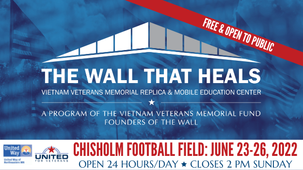 Blue background of flags reflected in the Vietnam Veterans Memorial. In foreground is The Wall That Heals logo with a red banner that says "Free and Open to the Public." On the bottom is a white bar with the UWNEMN logo and United for Veterans logo. In red letters it read: Chisholm Football Field June 23-26, 2022.
