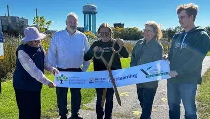  Representatives from the Virginia Community Foundation and Virginia Chisholm Credit Union, City of Virginia, and United Way of Northeastern Minnesota cut the ribbon October 2 commemorating the new Born learning Trail along Silver Lake.