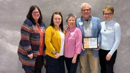 Backus Community Center Event Coordinator Michelle Boelk (left), Office Assistant Alyssa Crawford, Business Manager Hoa Sobczynski, Board of Directors President Steve Costley, and Executive Director Lois Lundin accepted United Way of Northeastern Minnesota’s Agency of the Year award March 21st at the Mountain Iron Community Center.